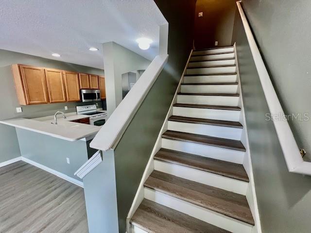 15655 Stable Run Drive Spring Hill, FL 34610 - Photo 23 of 48 a view of entryway and kitchen with wooden floor