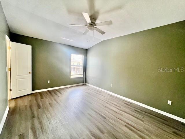 15655 Stable Run Drive Spring Hill, FL 34610 - Photo 25 of 48 wooden floor in an empty room with a window