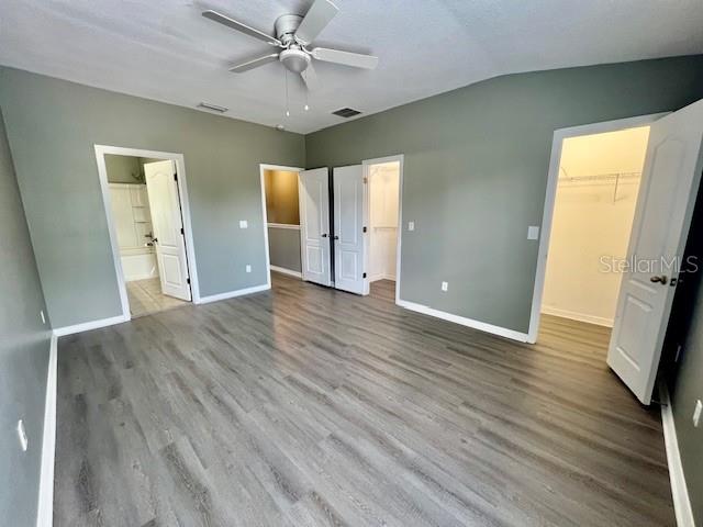 15655 Stable Run Drive Spring Hill, FL 34610 - Photo 26 of 48 wooden floor in an empty room with a window