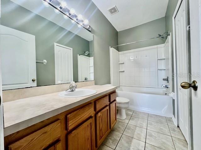 15655 Stable Run Drive Spring Hill, FL 34610 - Photo 29 of 48 a bathroom with a granite countertop sink a toilet and shower