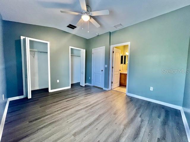 15655 Stable Run Drive Spring Hill, FL 34610 - Photo 32 of 48 an empty room with wooden floor and a ceiling fan