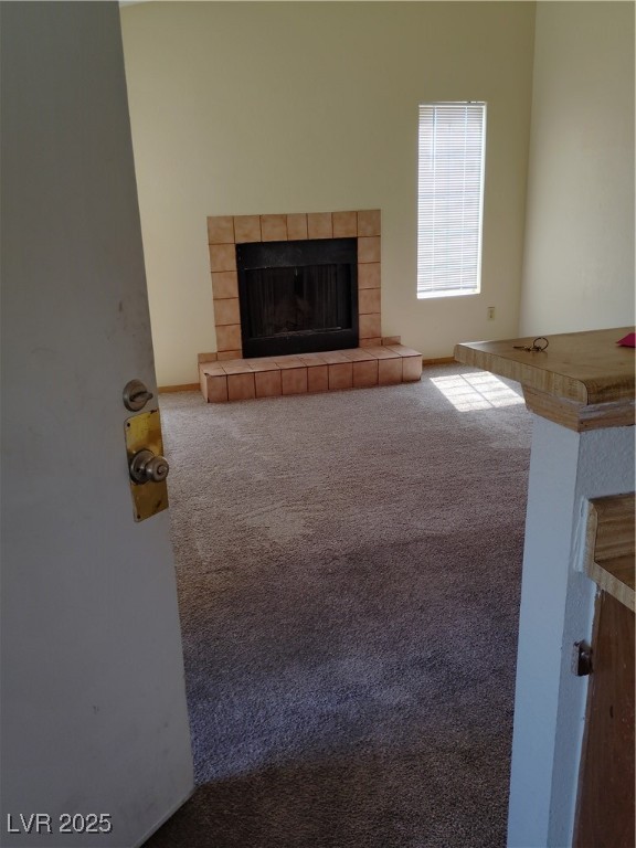 2686 Aarondavid Drive, Unit C Las Vegas, NV 89121 - Photo 3 of 3 Unfurnished living room with a tile fireplace and