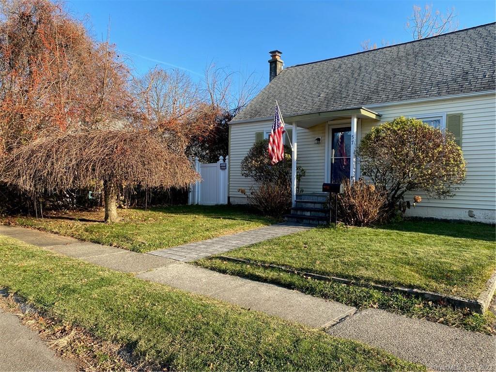 57 Greenfield Road Milford, CT 06460 - Photo 1 of 1 a view of a house with a yard and garage