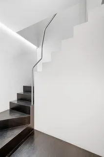 a bedroom with a bed and a fireplace