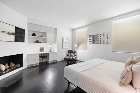 a bedroom with a bed and a chair