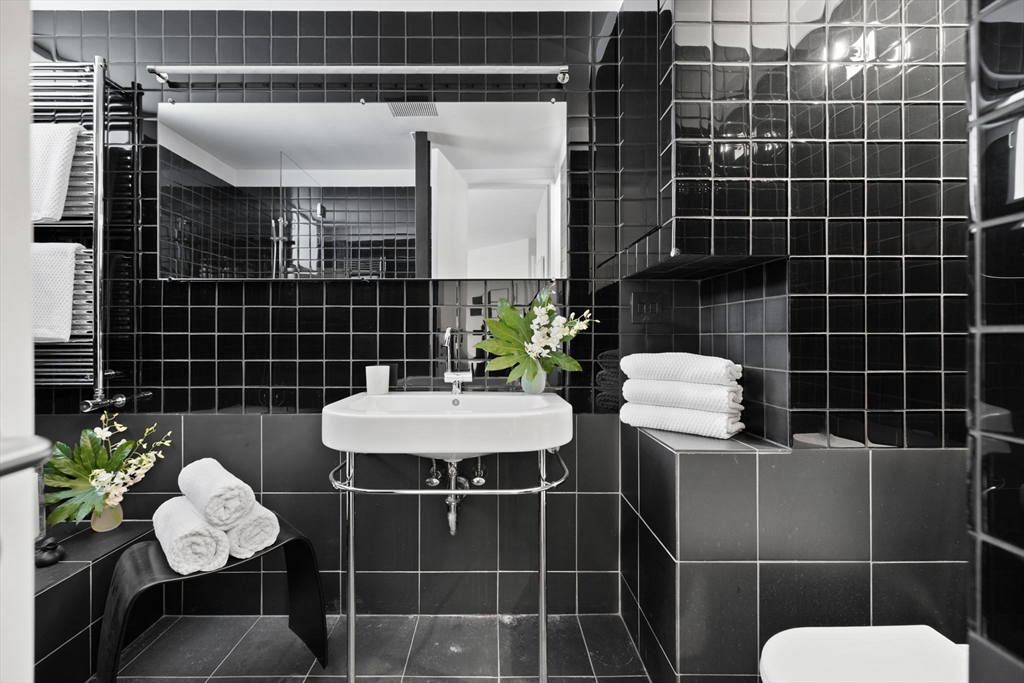 175 Commonwealth Avenue, Unit B Boston, MA 02116 - Photo 19 of 25 a bathroom with a sink toilet and shower