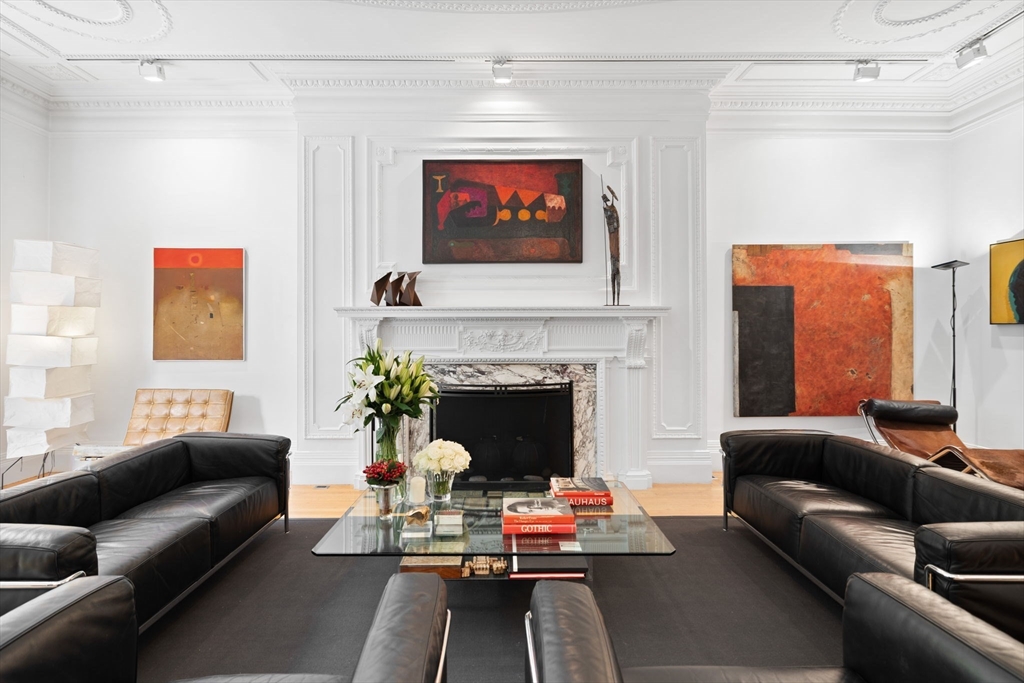 175 Commonwealth Avenue, Unit B Boston, MA 02116 - Photo 2 of 25 a living room with furniture and a fireplace