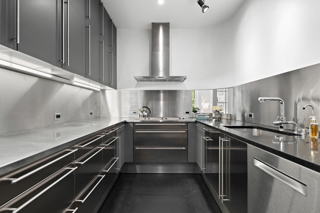 175 Commonwealth Avenue, Unit B Boston, MA 02116 - Photo 7 of 25 a kitchen with stainless steel appliances a sink stove and cabinets