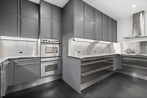a kitchen with appliances and cabinets