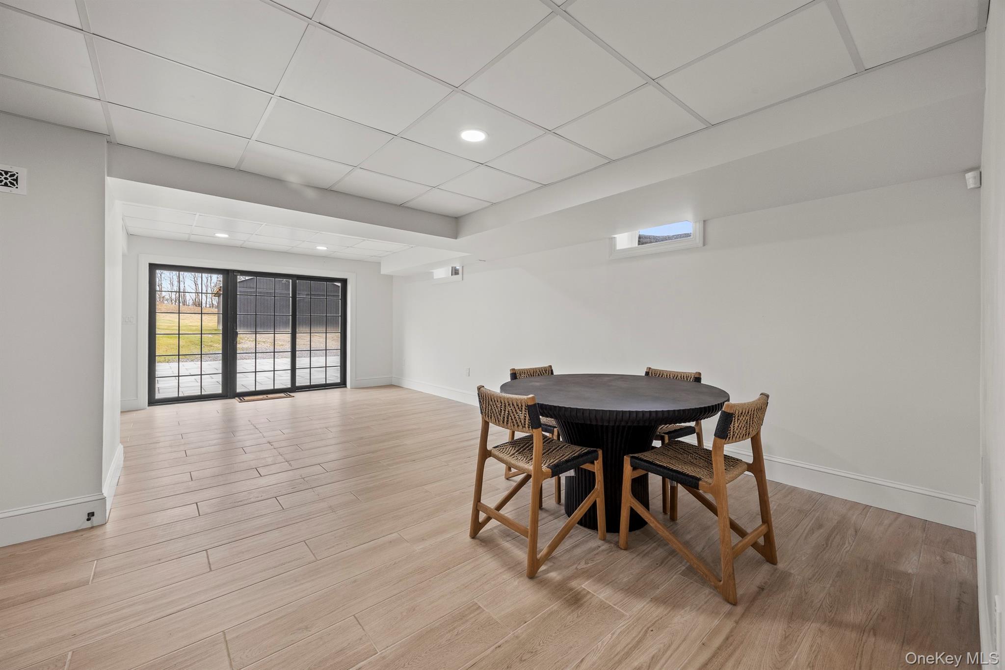 97 Valley Farm Road Millbrook, NY 12545 - Photo 31 of 49 a view of a dining room with furniture and wooden floor