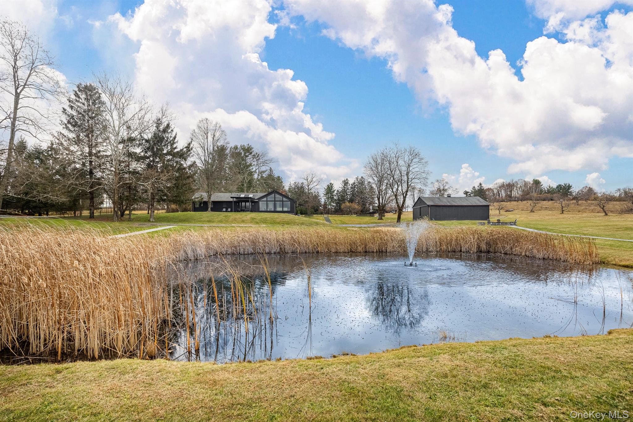 97 Valley Farm Road Millbrook, NY 12545 - Photo 39 of 49 a view of a lake with houses in the back
