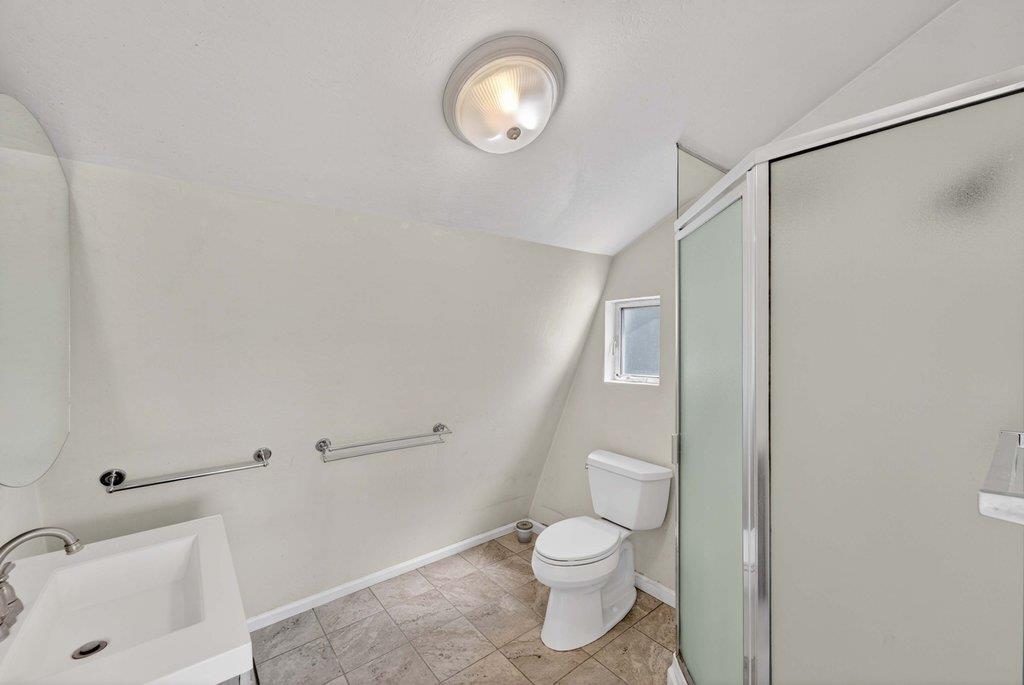 505 Hidden Valley Road Watsonville, CA 95076 - Photo 56 of 72 a bathroom with a toilet a sink and a mirror