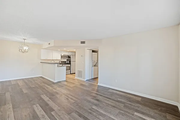 a view of kitchen with wooden floor