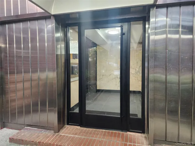 a bathroom with a glass shower door