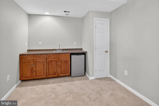 an empty room with a sink