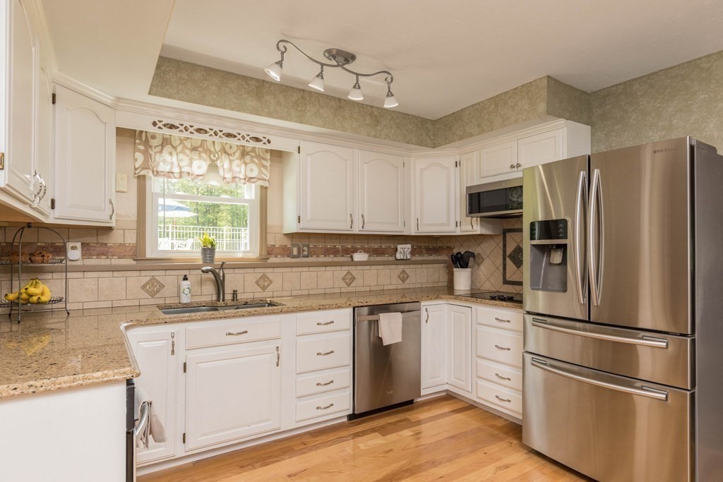 35 Lincoln Road Phillipston, MA 01331 - Photo 4 of 28 a kitchen with a refrigerator sink and cabinets