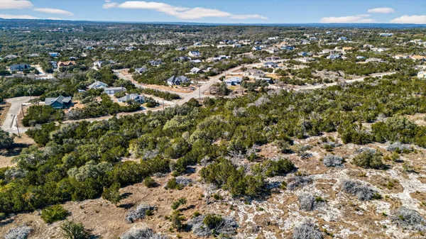 an aerial view of a residential houses and city street