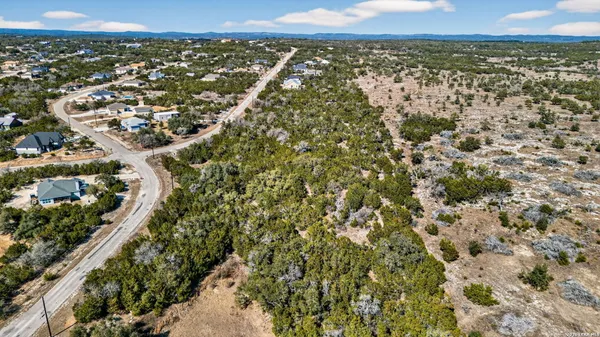 an aerial view of a residential houses and city view