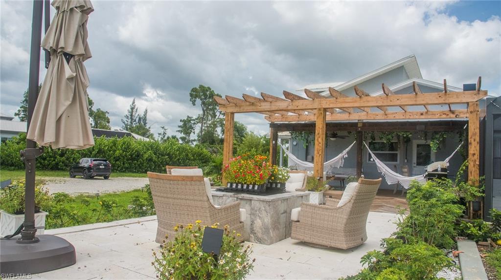 3220 63rd Street Southwest Naples, FL 34105 - Photo 34 of 36 View of patio with a pergola and ceiling fan