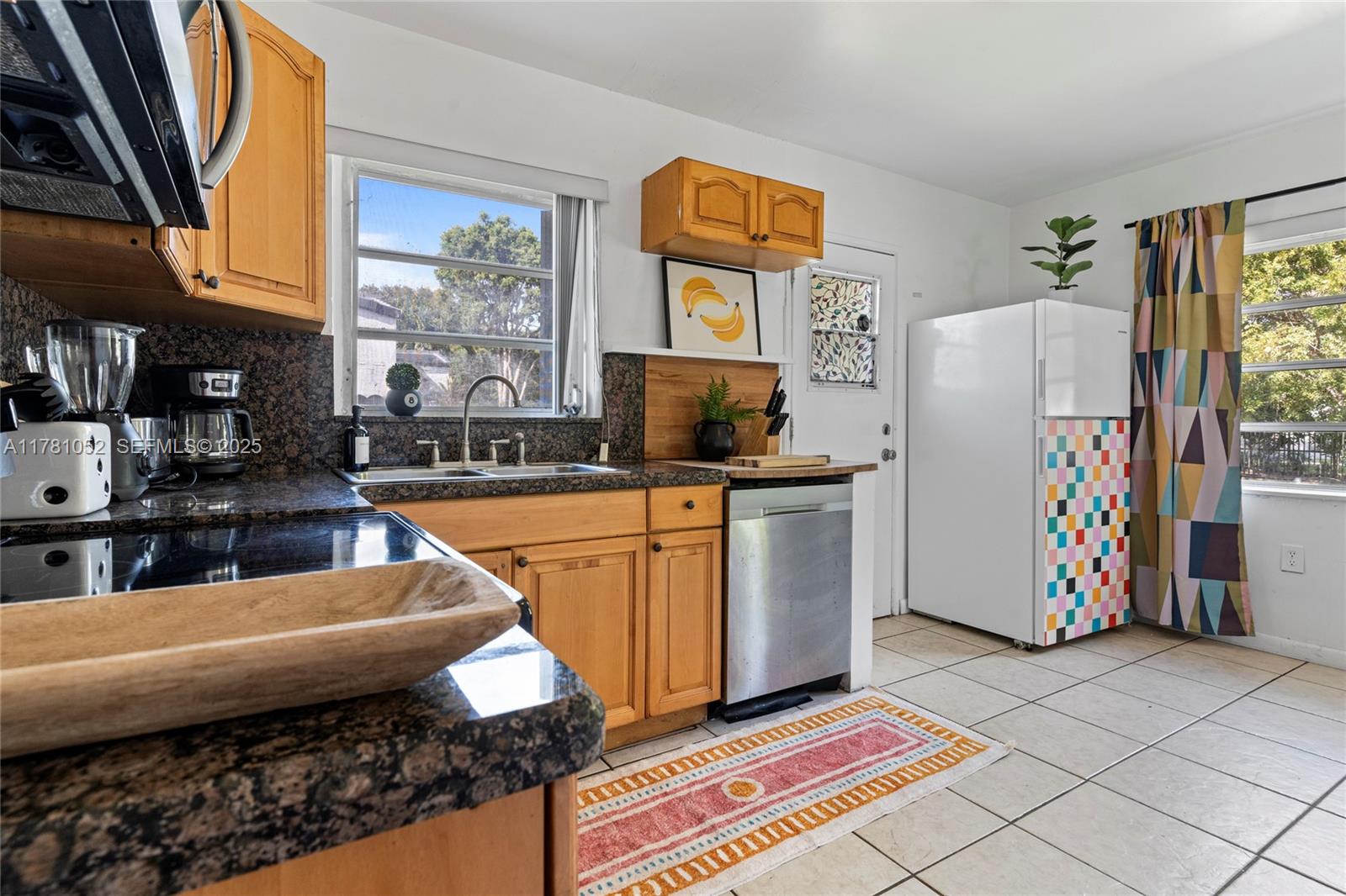 260 Northeast 45th Street Miami, FL 33137 - Photo 13 of 34 a kitchen with refrigerator and window