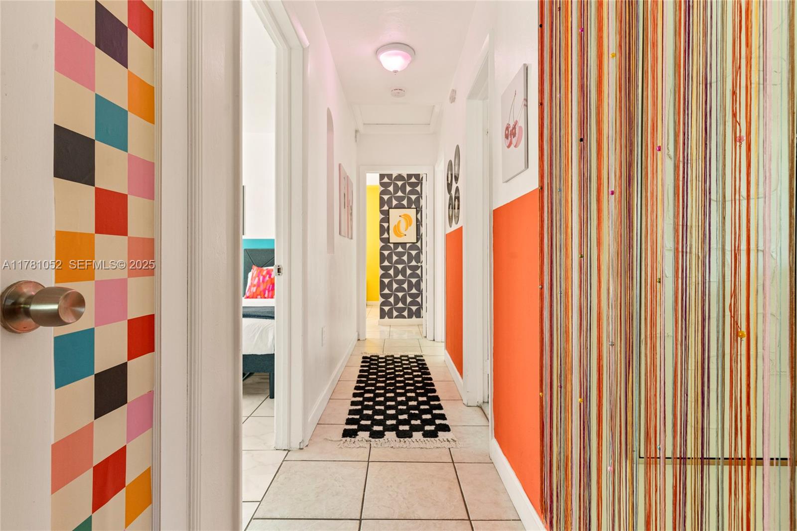 260 Northeast 45th Street Miami, FL 33137 - Photo 14 of 34 a view of a bathroom with a sink and a shower curtain