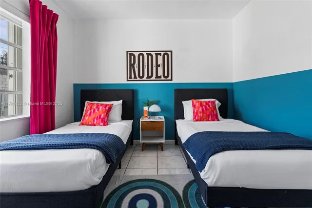 a bedroom with a bed and a chair