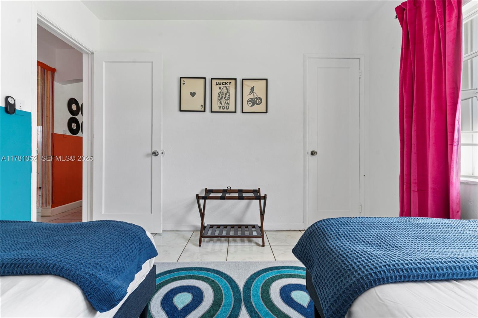 260 Northeast 45th Street Miami, FL 33137 - Photo 18 of 34 a bedroom with a bed and chair