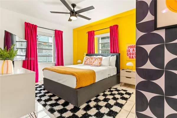 a bedroom with a bed and window