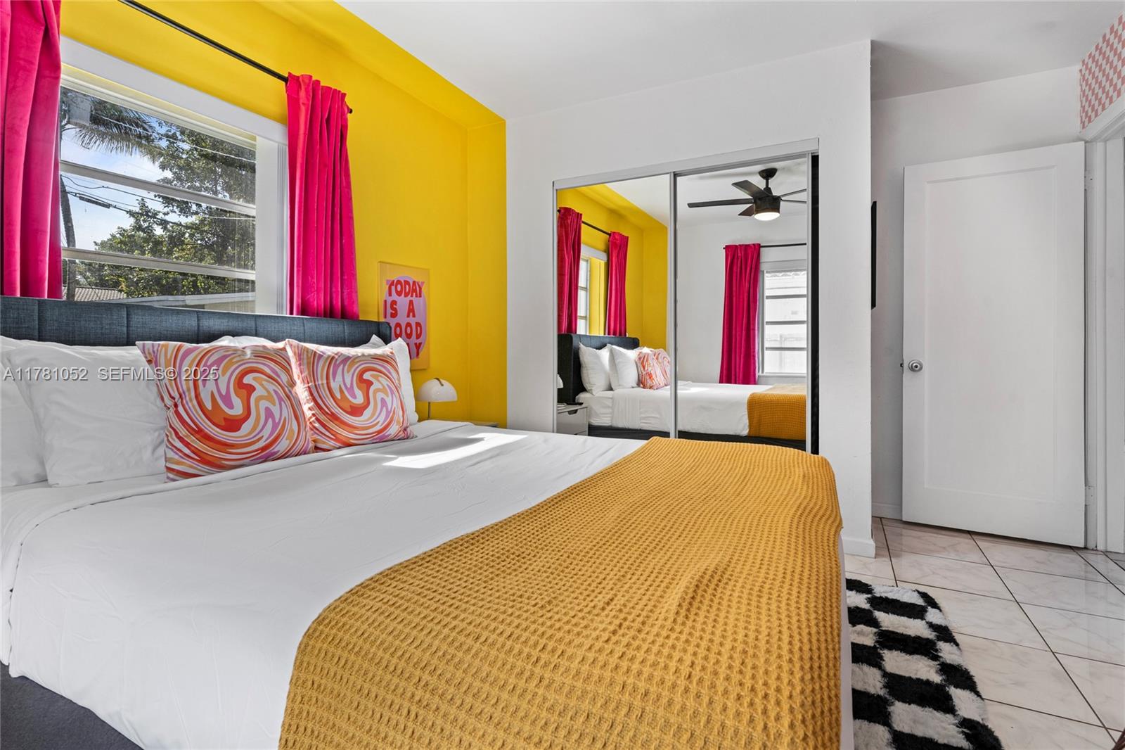 260 Northeast 45th Street Miami, FL 33137 - Photo 23 of 34 a bedroom with a bed and window