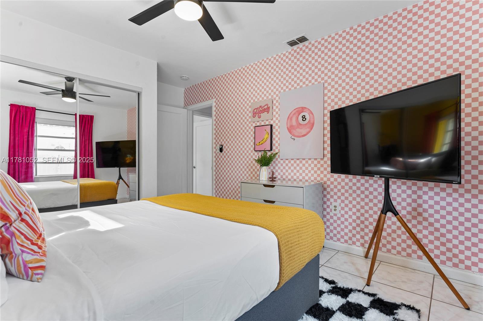 260 Northeast 45th Street Miami, FL 33137 - Photo 24 of 34 a bedroom with a bed and a flat screen tv