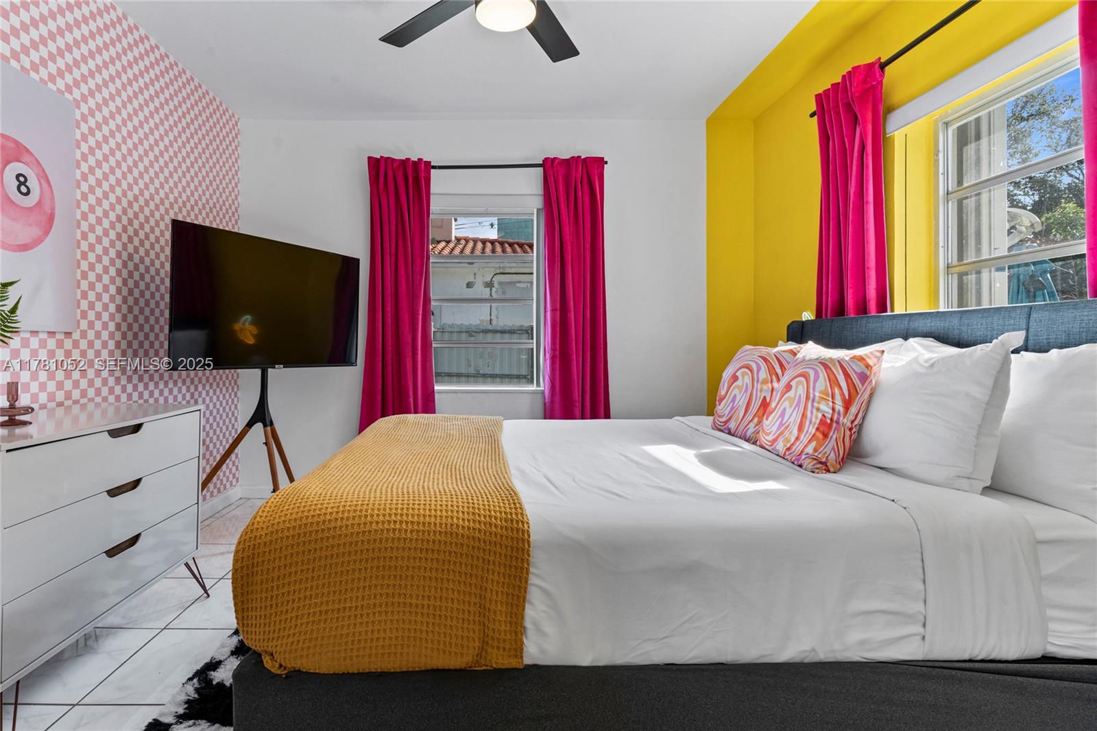 260 Northeast 45th Street Miami, FL 33137 - Photo 25 of 34 a bedroom with a bed and flat screen tv