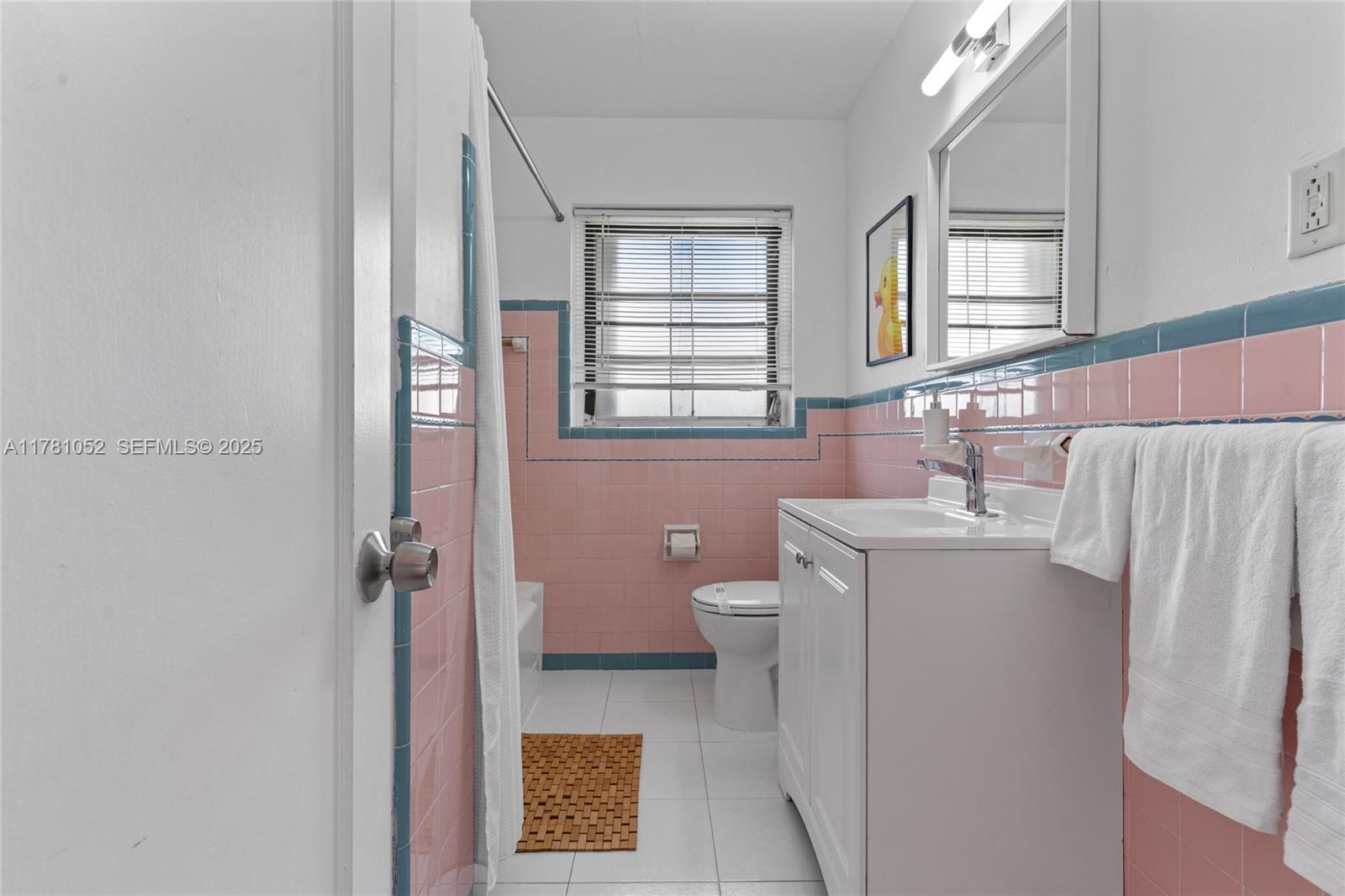 260 Northeast 45th Street Miami, FL 33137 - Photo 26 of 34 a bathroom with a sink toilet and window