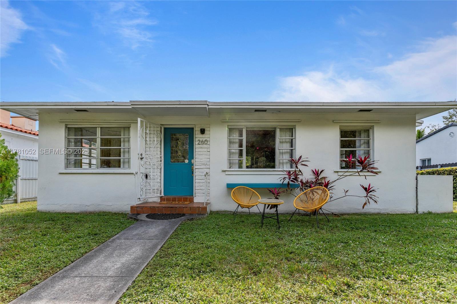 260 Northeast 45th Street Miami, FL 33137 - Photo 30 of 34 a view of a house with backyard sitting area and garden