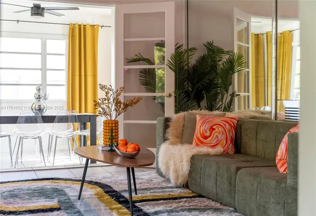 a view of a dining room with furniture and a window