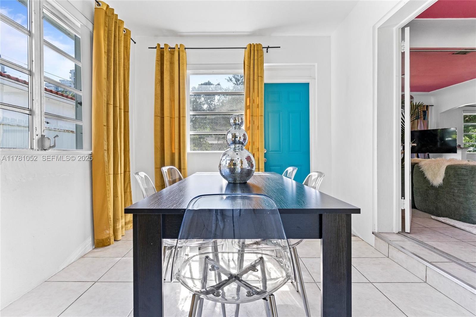260 Northeast 45th Street Miami, FL 33137 - Photo 9 of 34 a view of a dining room with furniture and a window