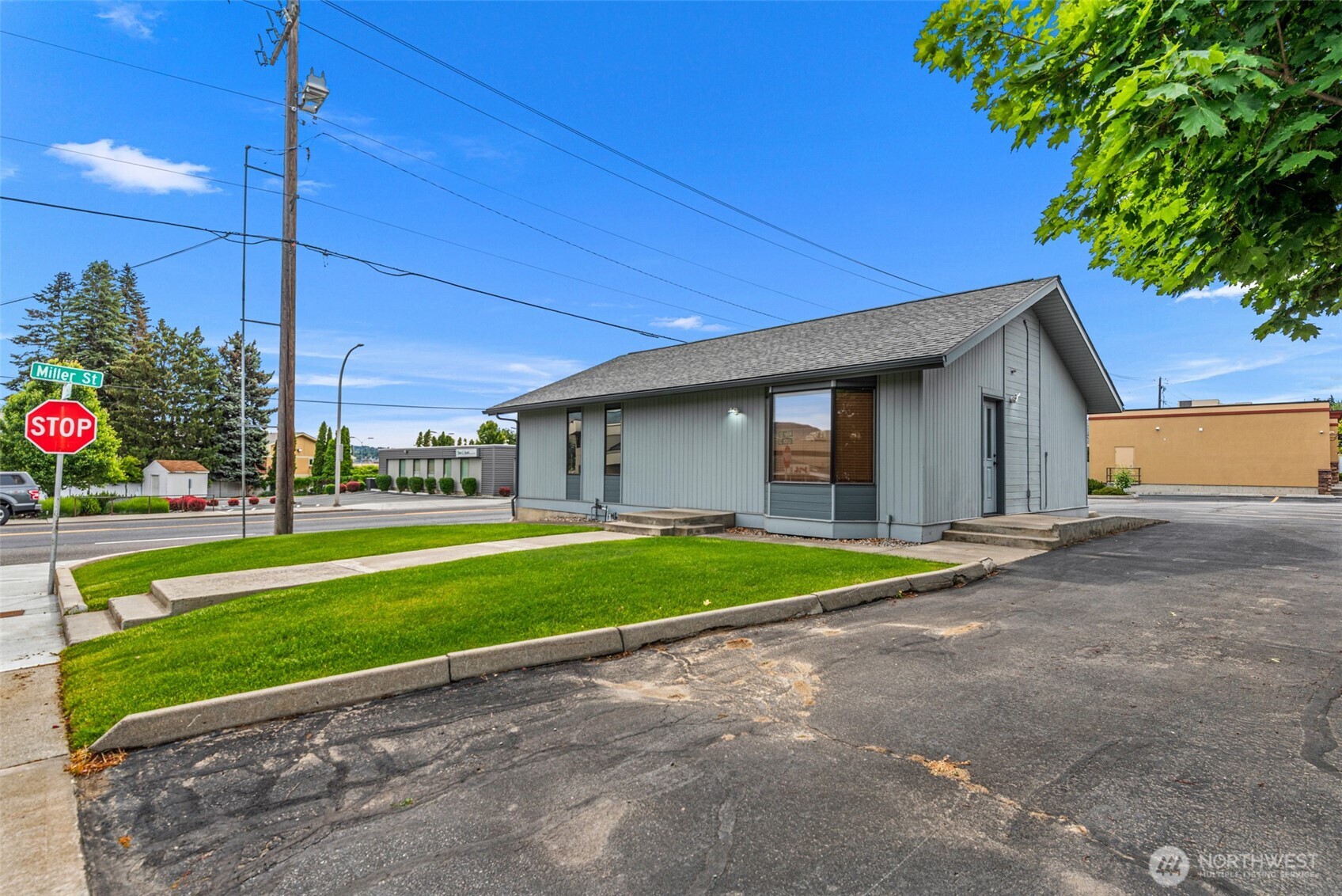710 North Miller Street Wenatchee, WA 98801 - Photo 31 of 33 a view of a house with a backyard and a garage