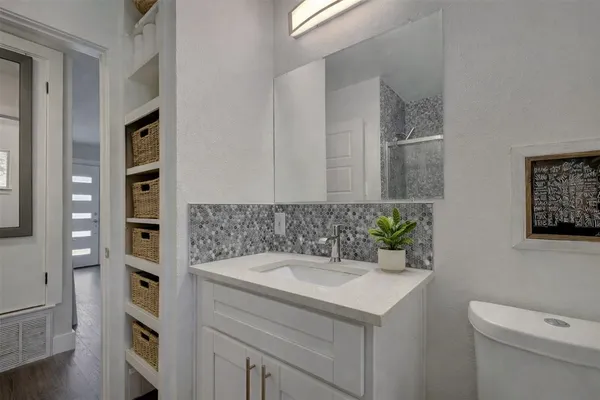 a bathroom with a sink and a toilet