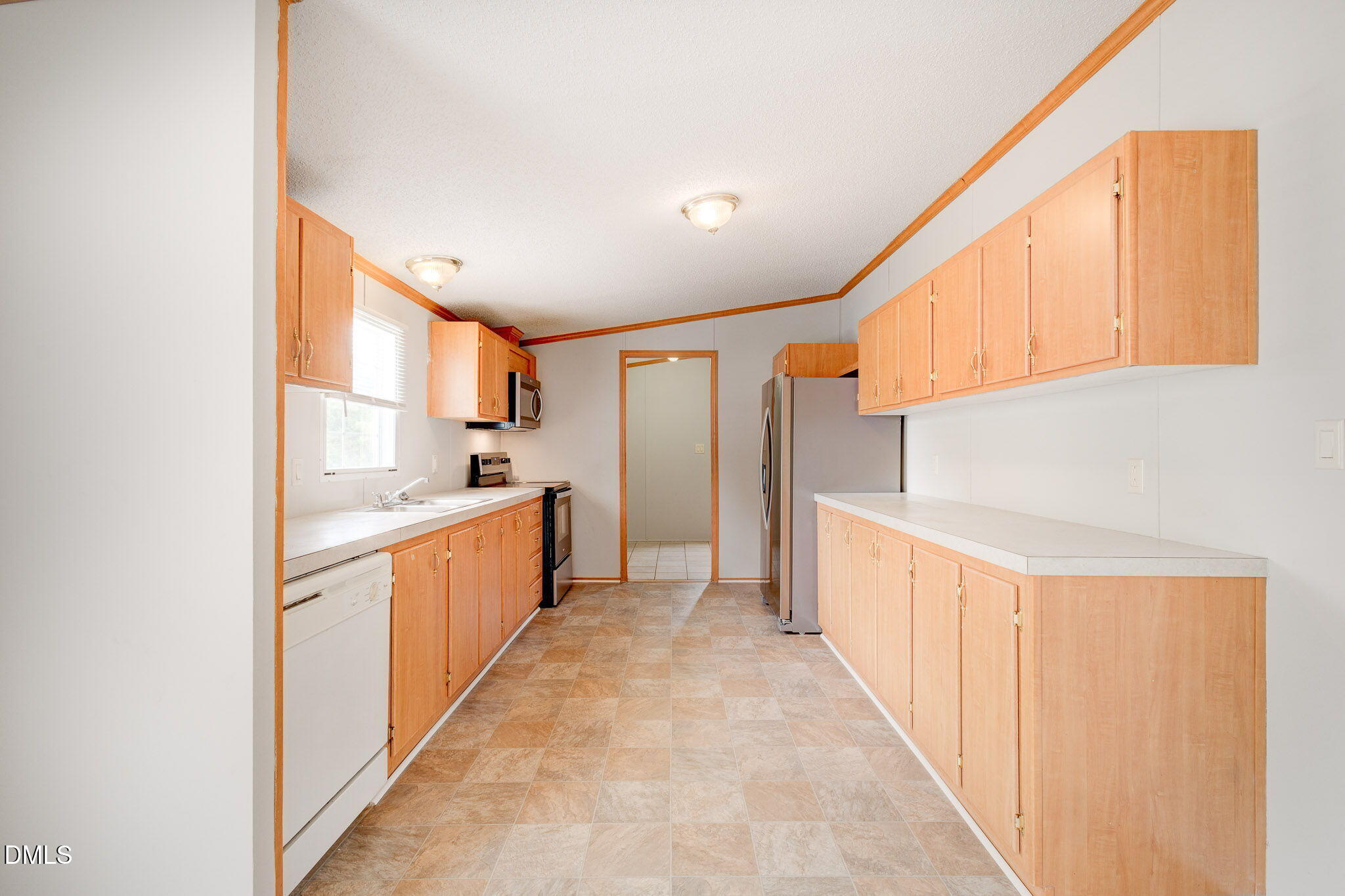 10037 Smith Road Middlesex, NC 27557 - Photo 6 of 36 a kitchen with white cabinets and sink