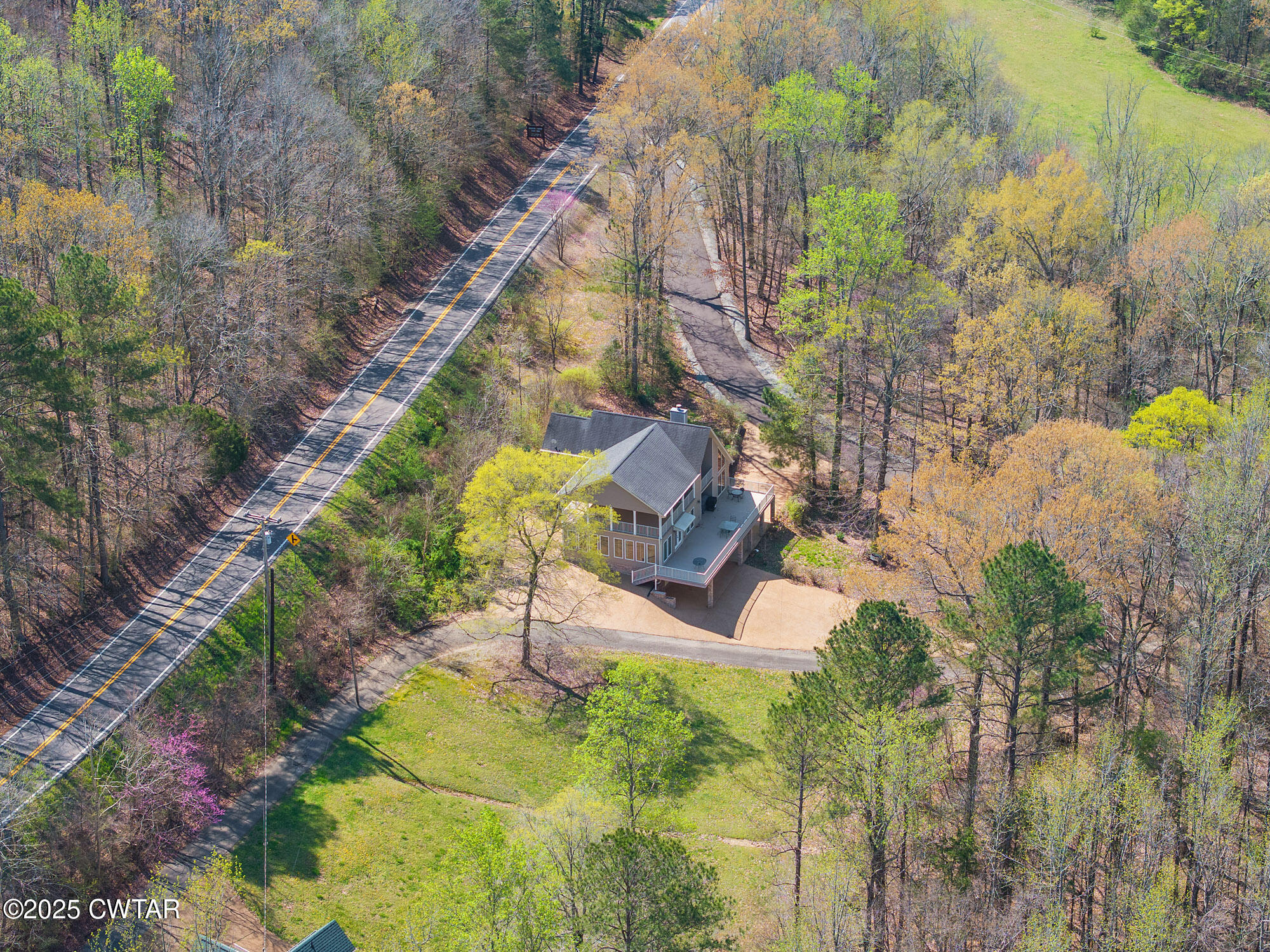 48 Old Pump Station Road Linden, TN 37096 - Photo 12 of 49 a view of a yard with plants and large trees