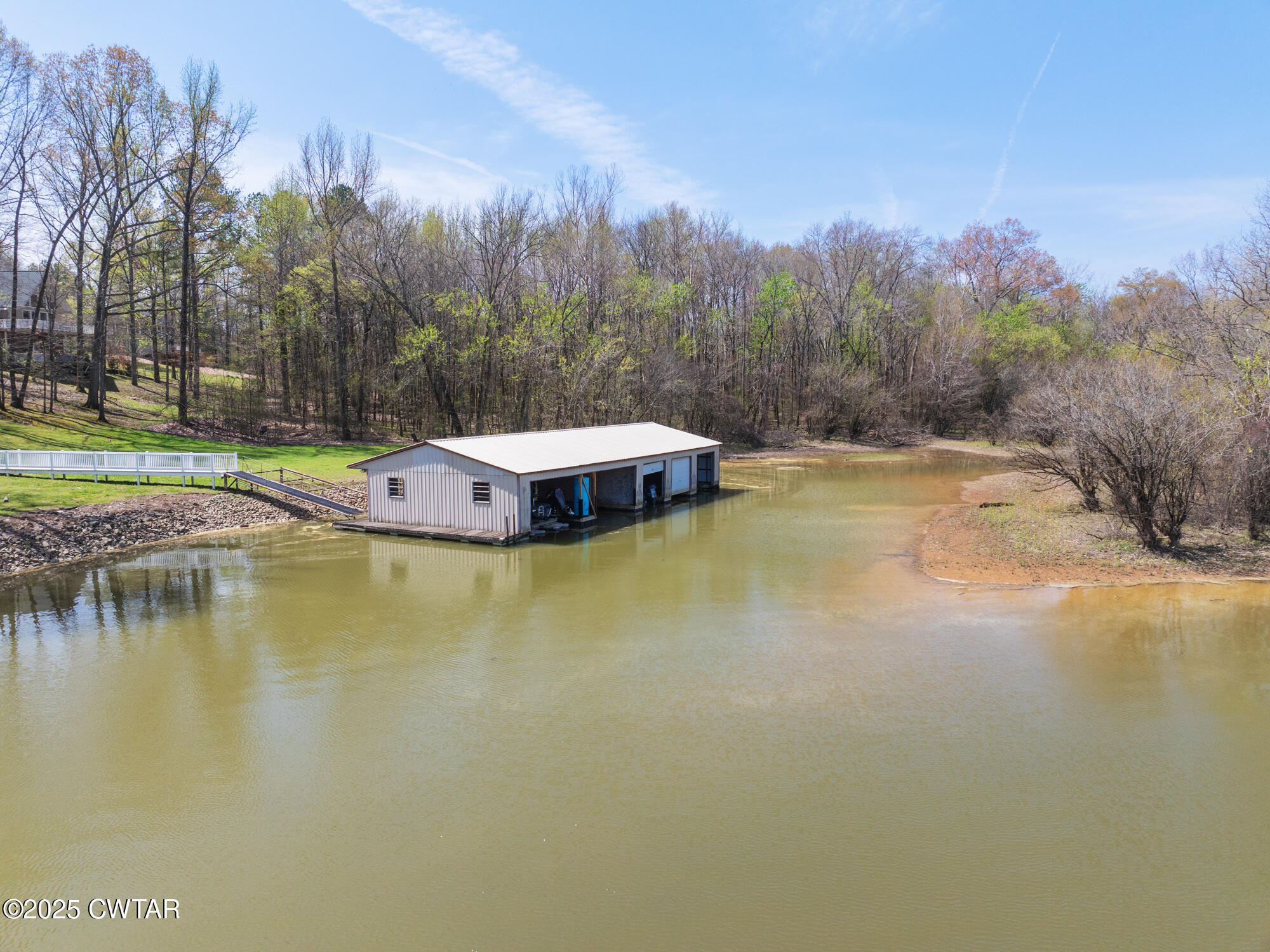 48 Old Pump Station Road Linden, TN 37096 - Photo 19 of 49 a view of a swimming pool with an outdoor space and seating area