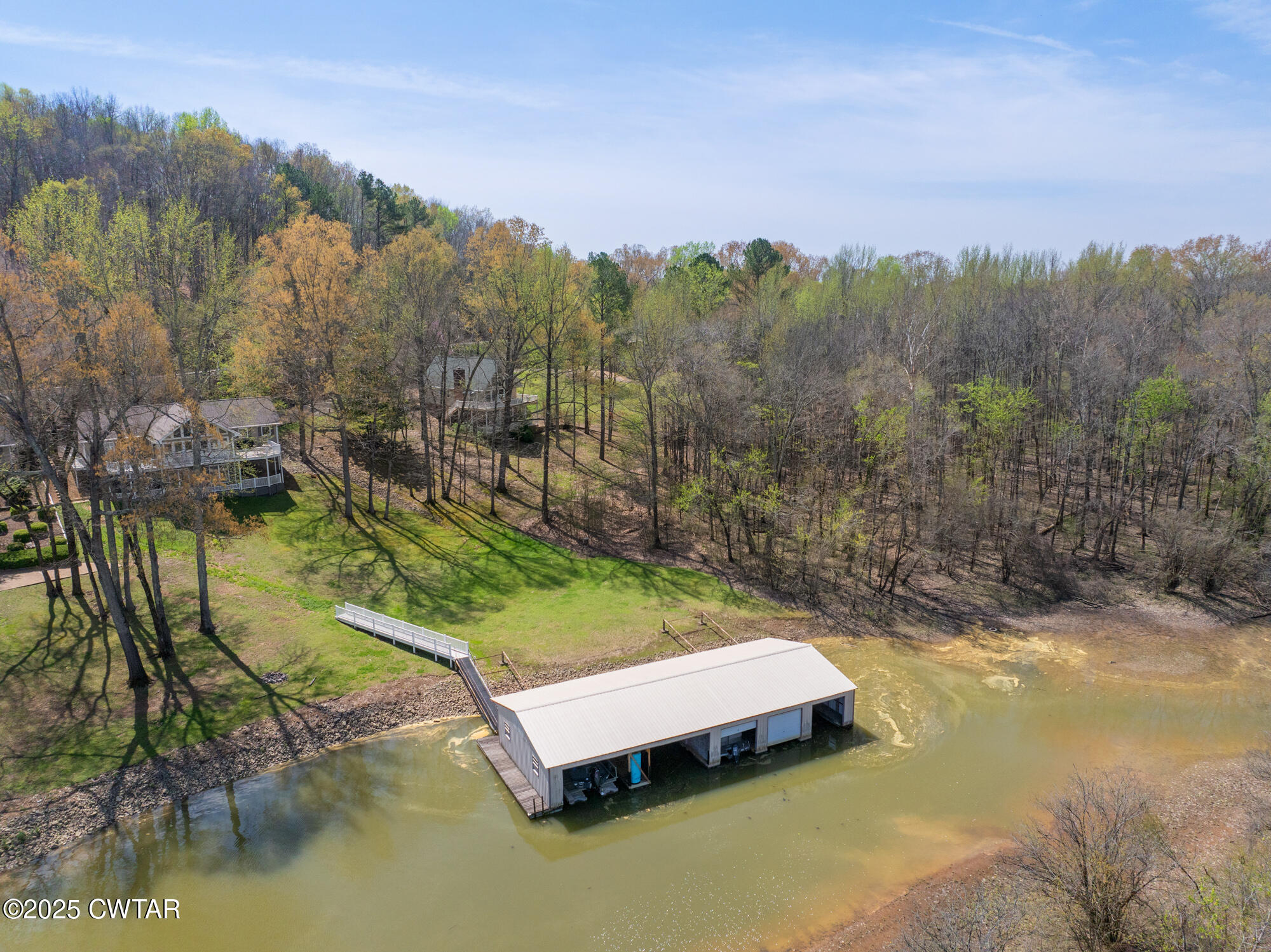 48 Old Pump Station Road Linden, TN 37096 - Photo 20 of 49 a view of a swimming pool with a yard and large trees