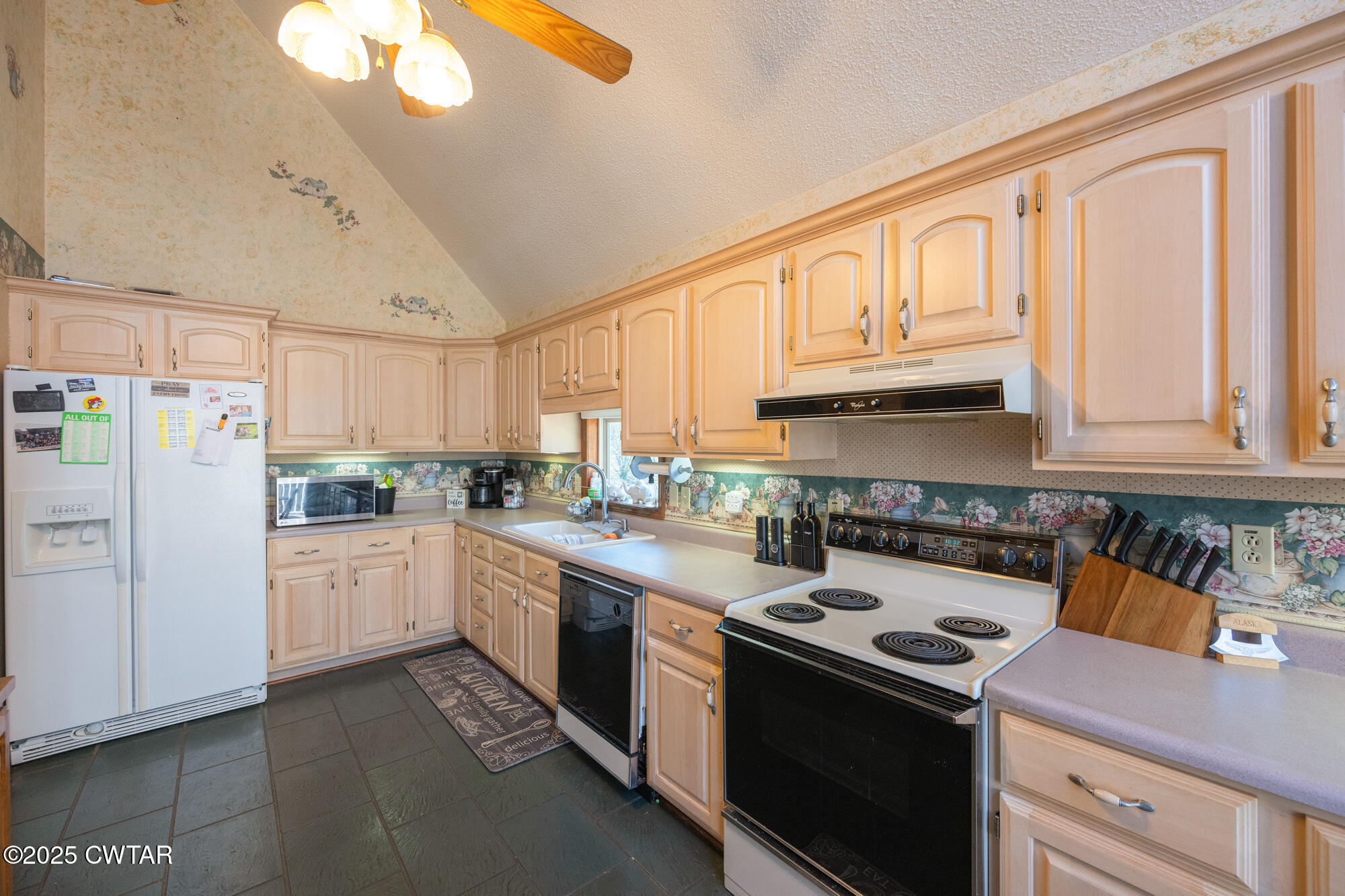 48 Old Pump Station Road Linden, TN 37096 - Photo 26 of 49 a kitchen with granite countertop a sink stainless steel appliances and cabinets