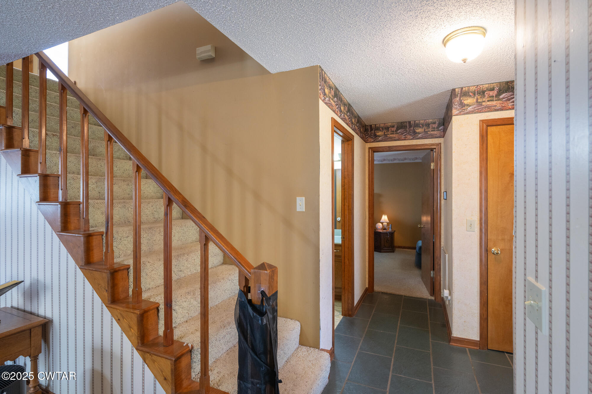48 Old Pump Station Road Linden, TN 37096 - Photo 27 of 49 a view of a hallway with wooden floor and staircase