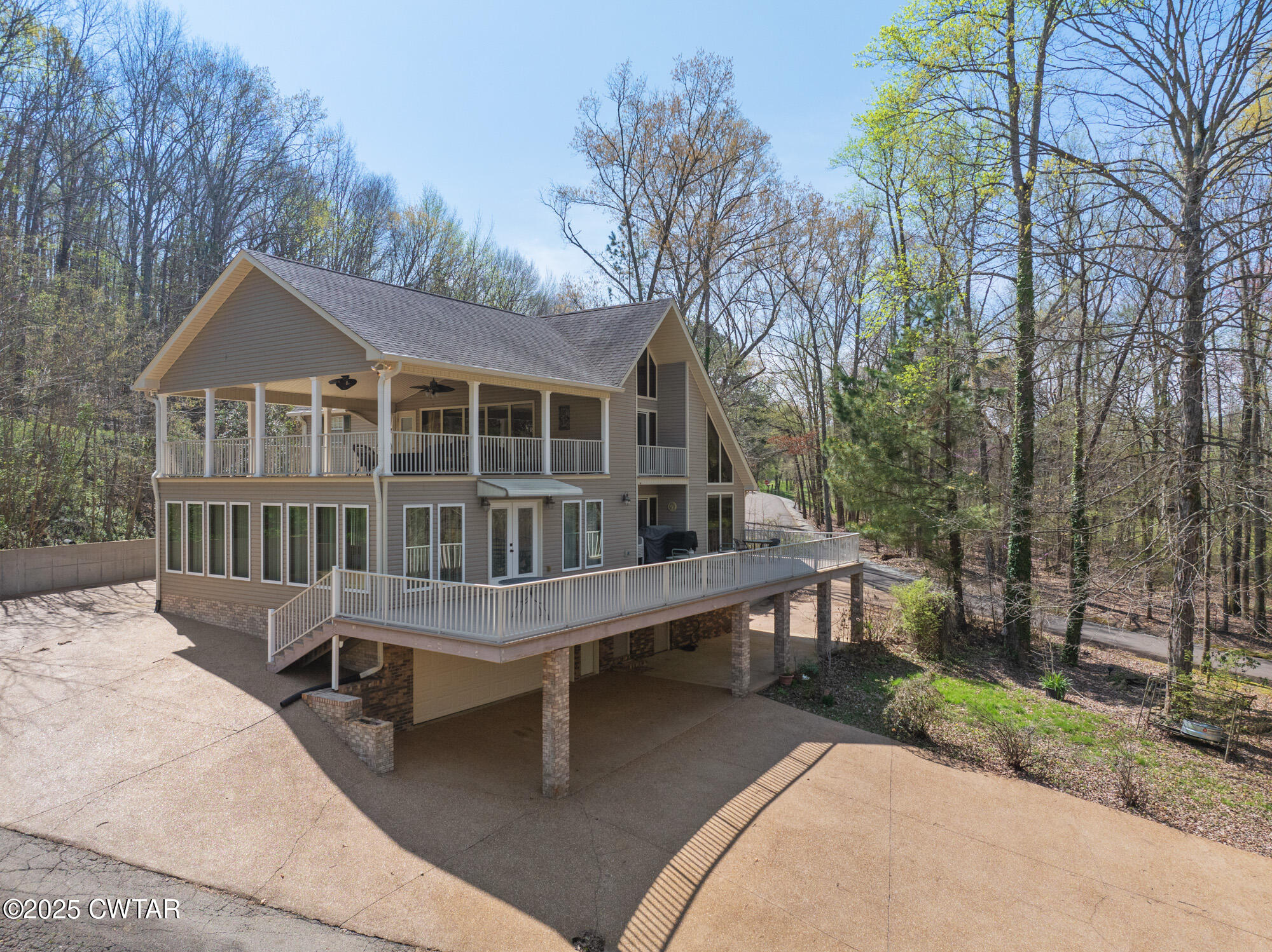 48 Old Pump Station Road Linden, TN 37096 - Photo 3 of 49 a view of a house with a wooden deck and a yard