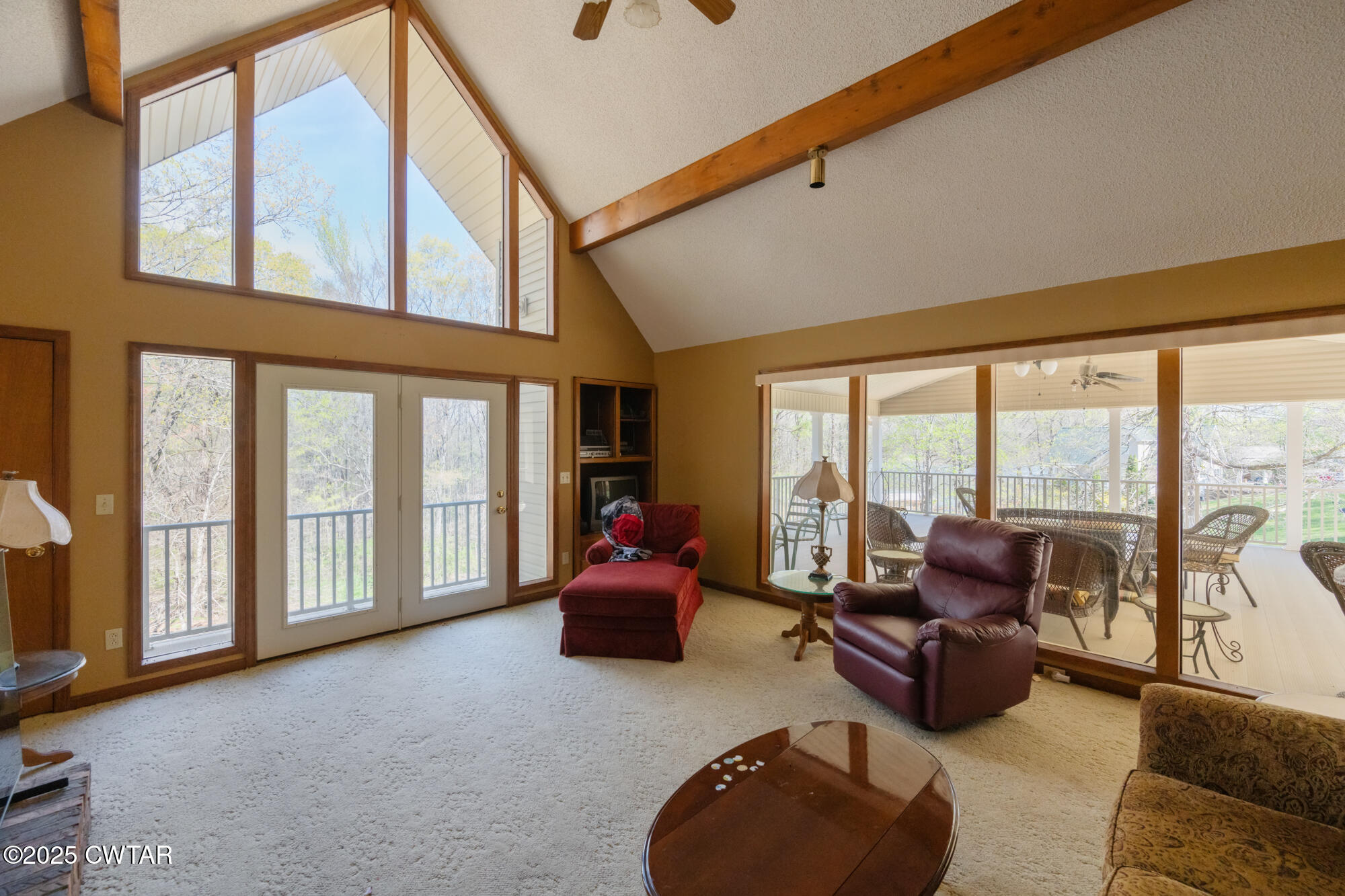 48 Old Pump Station Road Linden, TN 37096 - Photo 32 of 49 a living room with furniture and floor to ceiling windows
