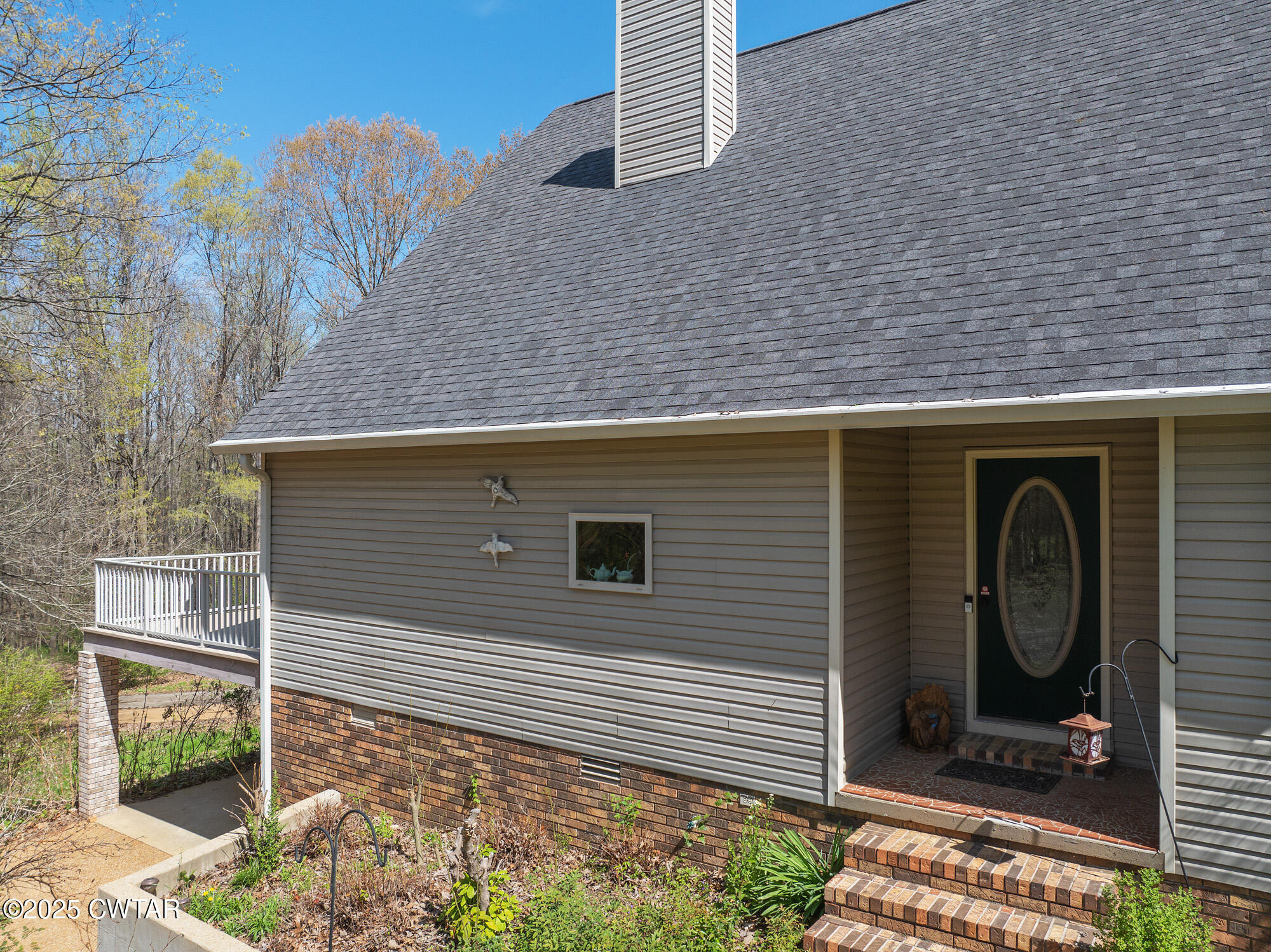 48 Old Pump Station Road Linden, TN 37096 - Photo 8 of 49 a side view of a house with a door