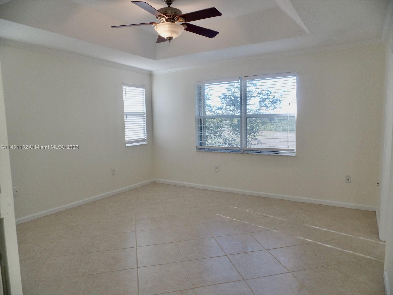 4744 Southwest 165th Avenue, Unit 4744 Miramar, FL 33027 - Photo 11 of 34 a view of an empty room with a window