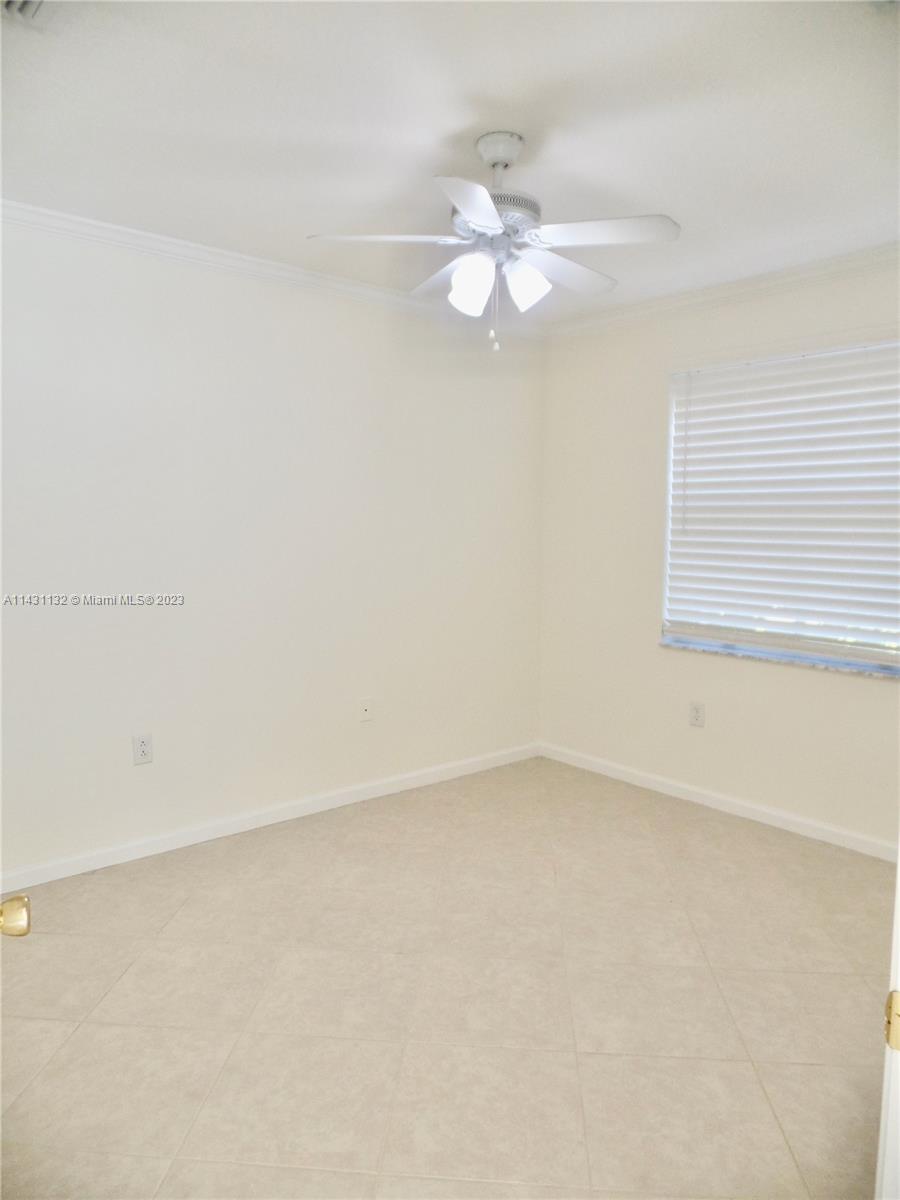 4744 Southwest 165th Avenue, Unit 4744 Miramar, FL 33027 - Photo 16 of 34 an empty room with a window and a fan