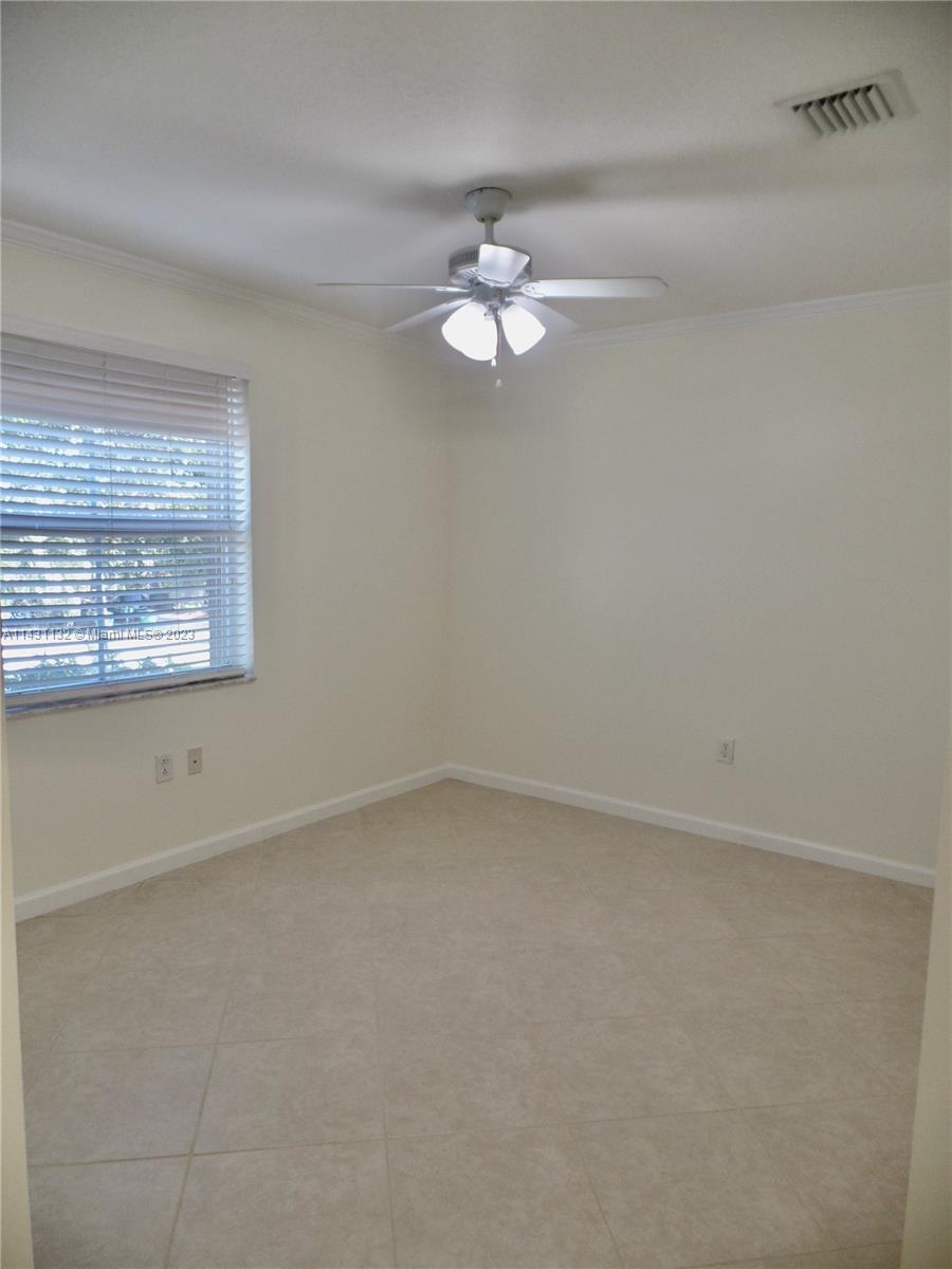 4744 Southwest 165th Avenue, Unit 4744 Miramar, FL 33027 - Photo 17 of 34 an empty room with a window