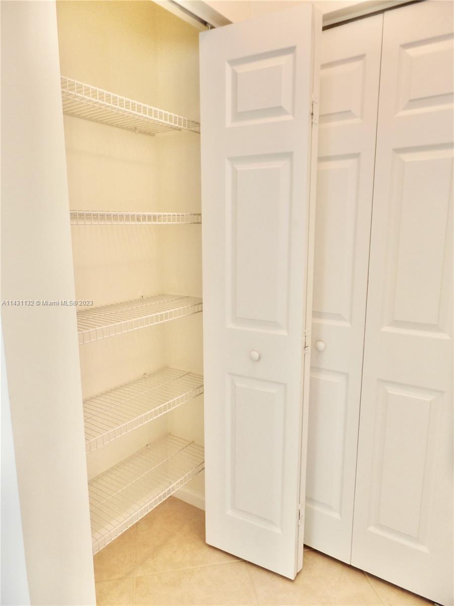 4744 Southwest 165th Avenue, Unit 4744 Miramar, FL 33027 - Photo 20 of 34 a view of an empty walk in closet